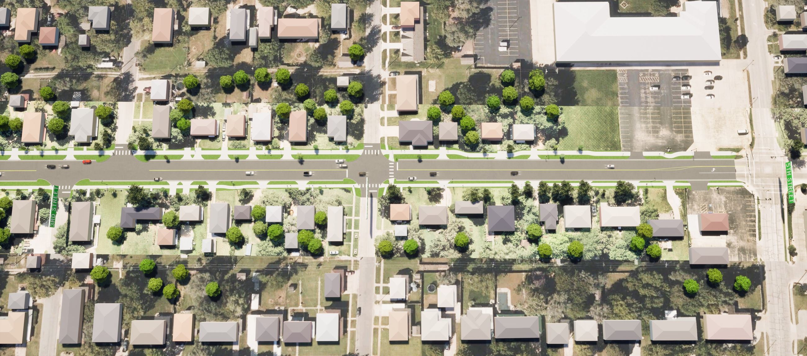 Aerial view of a neighborhood featuring houses and lush green trees interspersed throughout the area
